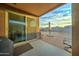 Covered patio with sliding glass door, built-in grill, and view of backyard at 19945 W Badgett Ln, Litchfield Park, AZ 85340