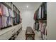 Large walk-in closet with ample shelving and hanging space at 19945 W Badgett Ln, Litchfield Park, AZ 85340