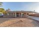 House exterior with stone accents, covered parking and landscaped yard at 2009 W Greenbriar Dr, Phoenix, AZ 85023