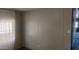 Small bedroom with wood paneled walls and sheer curtains at 201 S Greenfield Rd # 16, Mesa, AZ 85206