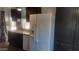Kitchen with dark brown cabinets, white appliances, and double sink at 201 S Greenfield Rd # 16, Mesa, AZ 85206