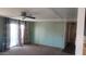 Living room with light green walls, patterned curtains, and carpeted floor at 201 S Greenfield Rd # 16, Mesa, AZ 85206