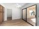Bedroom with patio access and view of backyard at 21214 N 124Th Ave, Sun City West, AZ 85375