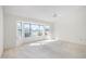 Spacious bedroom featuring a large window and golf course view at 21214 N 124Th Ave, Sun City West, AZ 85375