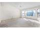 Bright bedroom with large window offering scenic views at 21214 N 124Th Ave, Sun City West, AZ 85375