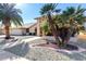 Another view of the home's exterior, highlighting the landscaping and walkway at 21214 N 124Th Ave, Sun City West, AZ 85375