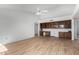 Gathering room with built-in shelving and wood flooring at 21214 N 124Th Ave, Sun City West, AZ 85375