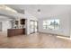 Kitchen boasts wood cabinets, breakfast bar, and access to patio at 21214 N 124Th Ave, Sun City West, AZ 85375