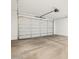 A spacious garage with an automatic door at 22551 W Pontiac Dr, Surprise, AZ 85387