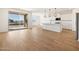 Open concept kitchen with a kitchen island, backyard access, and white cabinets at 22551 W Pontiac Dr, Surprise, AZ 85387