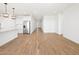 Modern open kitchen with an island, white cabinets, and stainless steel appliances at 22551 W Pontiac Dr, Surprise, AZ 85387