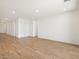 Spacious living room featuring recessed lighting and wood-look tile floors at 22551 W Pontiac Dr, Surprise, AZ 85387