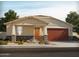 One-story home with a two-car garage and landscaped front yard at 22563 W Pontiac Dr, Surprise, AZ 85387