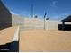 Vacant dirt lot backyard with block fence at 22563 W Pontiac Dr, Surprise, AZ 85387