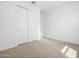 Bedroom with sliding door closet and carpet at 22563 W Pontiac Dr, Surprise, AZ 85387