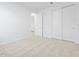 Bedroom with carpet, closet, and attached bathroom at 22563 W Pontiac Dr, Surprise, AZ 85387