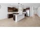Kitchen island with stainless appliances, granite countertops and backsplash at 22563 W Pontiac Dr, Surprise, AZ 85387