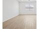 Bright living room with wood-look flooring, natural light, and recessed lighting at 22563 W Pontiac Dr, Surprise, AZ 85387