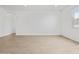 Bright living room with wood-look flooring, natural light, and recessed lighting at 22563 W Pontiac Dr, Surprise, AZ 85387