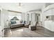 Bright living room featuring a cozy fireplace and hardwood floors at 2444 E Garnet Ave, Mesa, AZ 85204