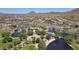 An aerial view of Anthem's community park with a lake, playground, and walking paths at 2527 W Kit Carson Trl, Anthem, AZ 85086