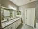 Double vanity bathroom with granite countertops and modern fixtures at 2527 W Kit Carson Trl, Phoenix, AZ 85086