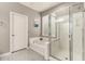 Spa-like bathroom with soaking tub and walk-in shower at 2527 W Kit Carson Trl, Phoenix, AZ 85086