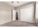 Bedroom with double door closet and access to bath at 2527 W Kit Carson Trl, Anthem, AZ 85086