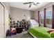 Bedroom with full-size bed and toy storage at 2527 W Kit Carson Trl, Anthem, AZ 85086