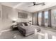 Main bedroom with a king-size bed and ensuite bathroom at 2527 W Kit Carson Trl, Anthem, AZ 85086
