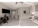 Bedroom with a king-size bed and exercise equipment at 2527 W Kit Carson Trl, Anthem, AZ 85086