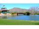 Scenic community lake with a gazebo and footbridge at 2527 W Kit Carson Trl, Anthem, AZ 85086