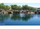 Community lake with playground and lush landscaping at 2527 W Kit Carson Trl, Anthem, AZ 85086