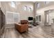 Spacious living room featuring hardwood floors, high ceilings, and a comfortable seating area at 2527 W Kit Carson Trl, Anthem, AZ 85086