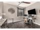 Home office with a large desk and two monitors at 2527 W Kit Carson Trl, Anthem, AZ 85086
