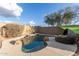 Inviting backyard pool with comfortable seating area at 2527 W Kit Carson Trl, Anthem, AZ 85086