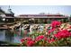 Charming train station with a pond and waterfall, surrounded by pink flowers at 2527 W Kit Carson Trl, Anthem, AZ 85086