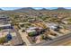 Aerial view showcasing a large house, expansive property, and surrounding neighborhood at 2625 W Desert Hills Dr, Phoenix, AZ 85086