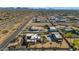 Aerial view of a large property with two houses and a pool; expansive desert landscape in the background at 2625 W Desert Hills Dr, Phoenix, AZ 85086