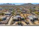 Aerial view of a luxurious house with a large yard and circular driveway, located in a residential area at 2625 W Desert Hills Dr, Phoenix, AZ 85086