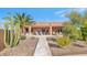 Spacious backyard oasis with covered patio and desert landscaping at 2625 W Desert Hills Dr, Phoenix, AZ 85086