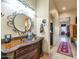 Bathroom with vanity, large mirror and access to bedroom at 2625 W Desert Hills Dr, Phoenix, AZ 85086