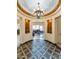 Stunning entry with a circular floor plan and a beautiful chandelier at 2625 W Desert Hills Dr, Phoenix, AZ 85086