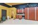 Garage with workshop, storage cabinets and a half bathroom at 2625 W Desert Hills Dr, Phoenix, AZ 85086