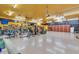 Well-organized garage with a home gym, ample storage, and a yellow color scheme at 2625 W Desert Hills Dr, Phoenix, AZ 85086