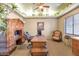 Spacious home office with built-in cabinetry and comfortable seating at 2625 W Desert Hills Dr, Phoenix, AZ 85086