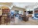 Island kitchen with breakfast bar and custom wood cabinetry at 2625 W Desert Hills Dr, Phoenix, AZ 85086