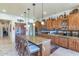 Gourmet kitchen boasts granite countertops, custom cabinetry, and high-end appliances at 2625 W Desert Hills Dr, Phoenix, AZ 85086