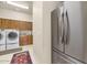 Bright laundry room with washer, dryer, and ample cabinetry at 2625 W Desert Hills Dr, Phoenix, AZ 85086