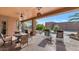 Covered patio with seating area and views of the backyard at 2625 W Desert Hills Dr, Phoenix, AZ 85086